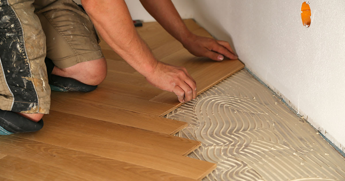 Glue down installation of herringbone wood flooring